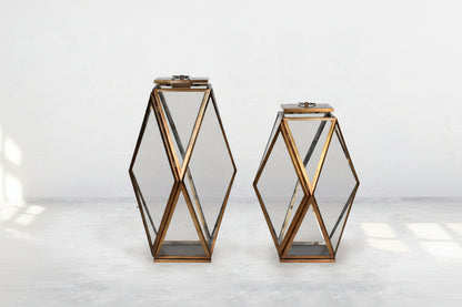Lantern with clear glass and brass-plated stainless steel.