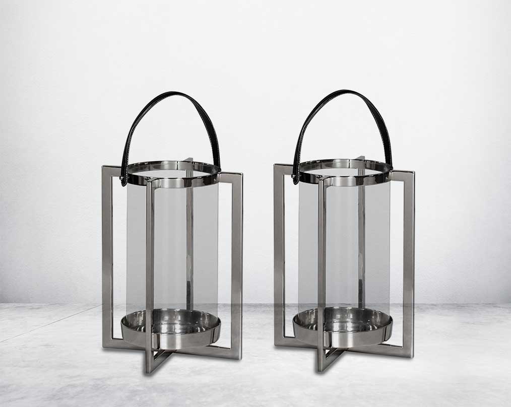 this lantern A master of reimagining classic forms, solid sheet metal frames feature broad panels of clear glass in a circular design