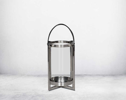 this lantern A master of reimagining classic forms, solid sheet metal frames feature broad panels of clear glass in a circular design small