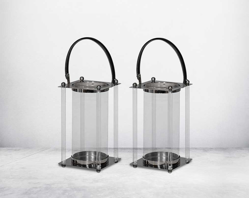 This lantern is crafted from leather, glass, and stainless steel and is perfect for adding aesthetic warmth and conviviality in any nighttime outdoor space. 1 large 2 small