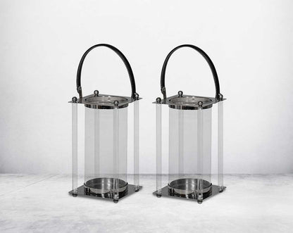 This lantern is crafted from leather, glass, and stainless steel and is perfect for adding aesthetic warmth and conviviality in any nighttime outdoor space. 1 large 2 small