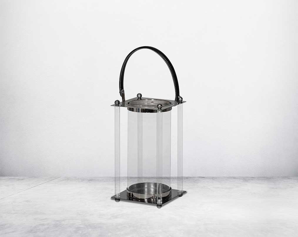 This lantern is crafted from leather, glass, and stainless steel and is perfect for adding aesthetic warmth and conviviality in any nighttime outdoor space. large