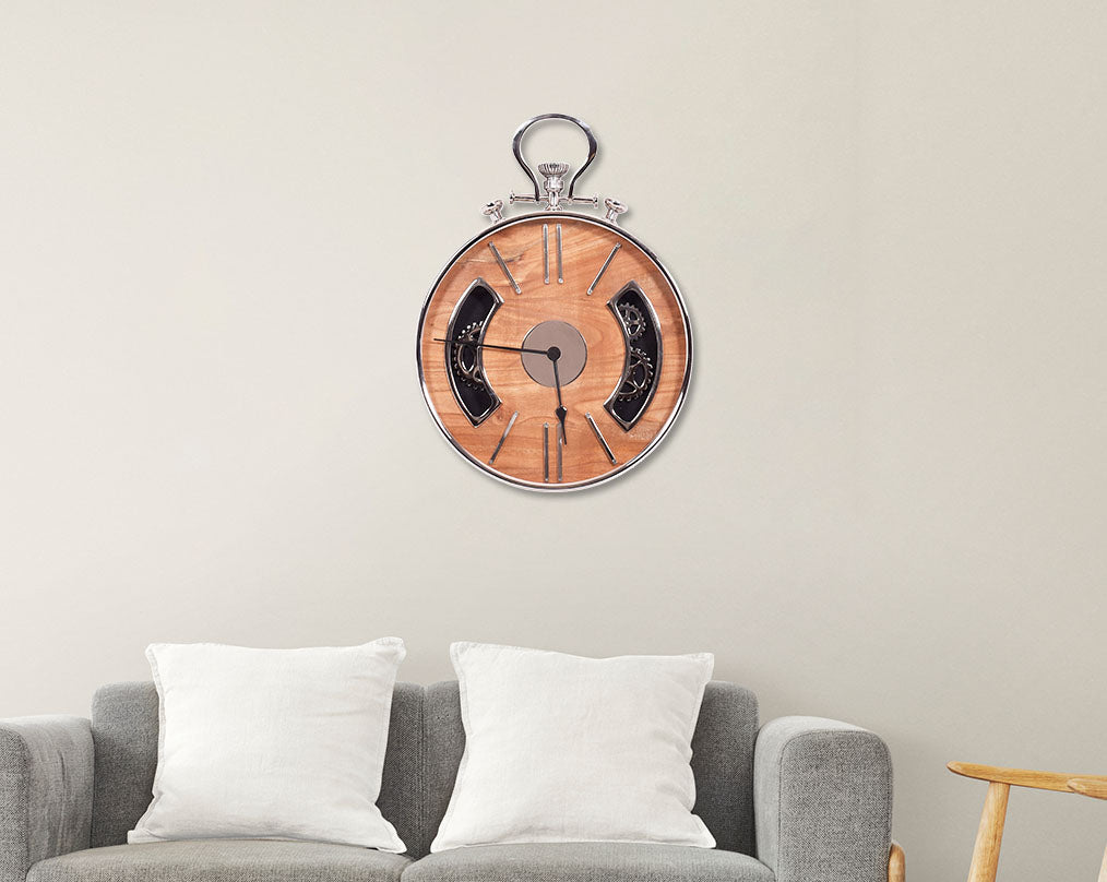 Round wall clock in nickel and wood in natural polish with roman numerals with sofa set