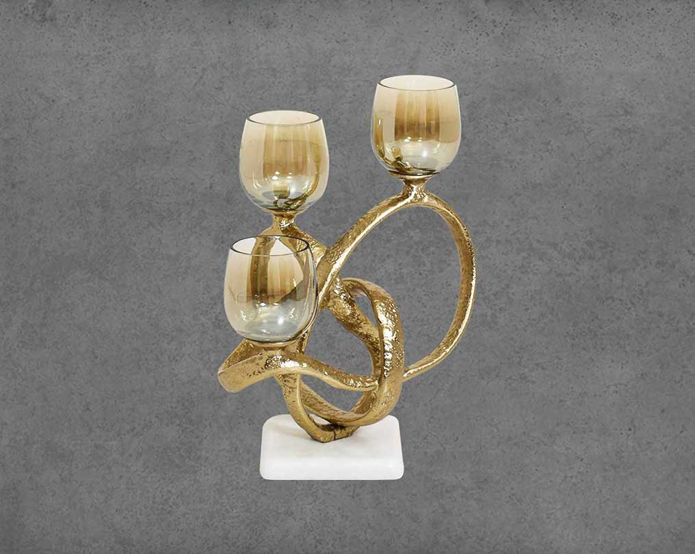 Multi T-light candle holder in gold-finished nickel plated aluminum, smoke luster glass with white marble base front view