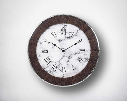 Round wall clock in nickel and rough wood in natural finish with roman numerals.