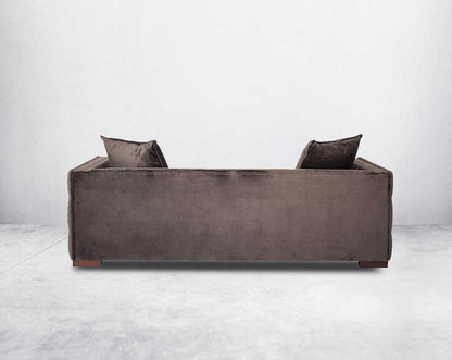 3 seater sofa set upholstered in fabric with gold rivets on the arms and front and tufted on the sides back view