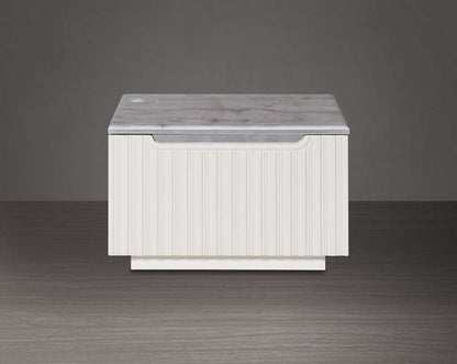The bedside table comes with front view  a marble finish top & lacquered in high gloss with a spacious drawer with a cream finish handle & base.