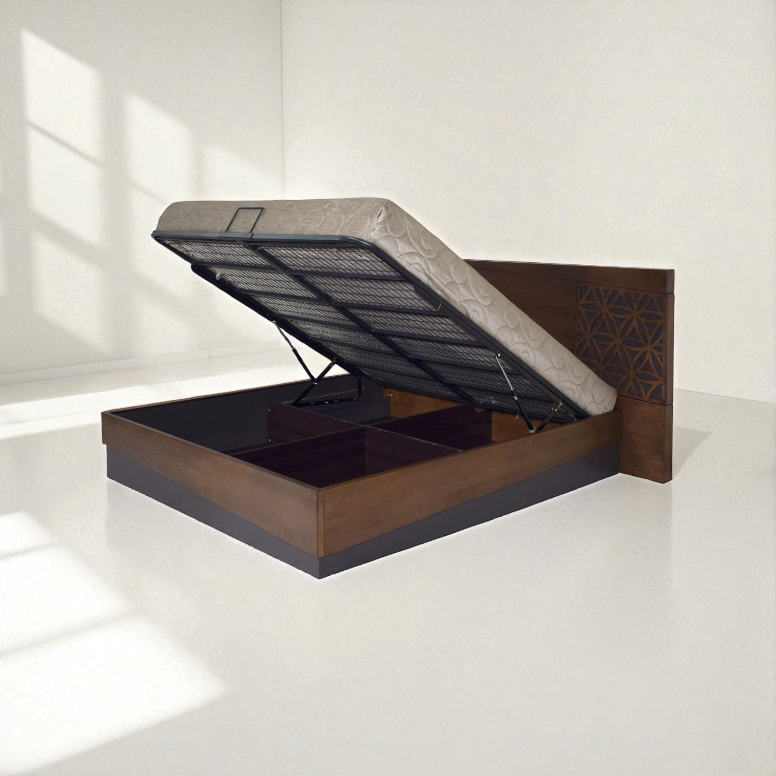 
Wooden bed with an open hydraulic storage compartment, showing mattress lifted up.