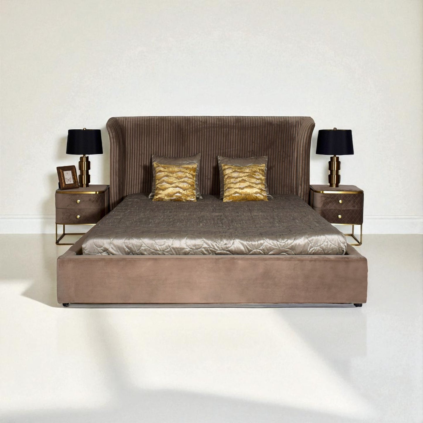 Brown upholstered bed with gold accents in a minimalistic room.