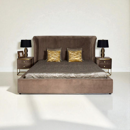 Brown upholstered bed with gold accents in a minimalistic room.