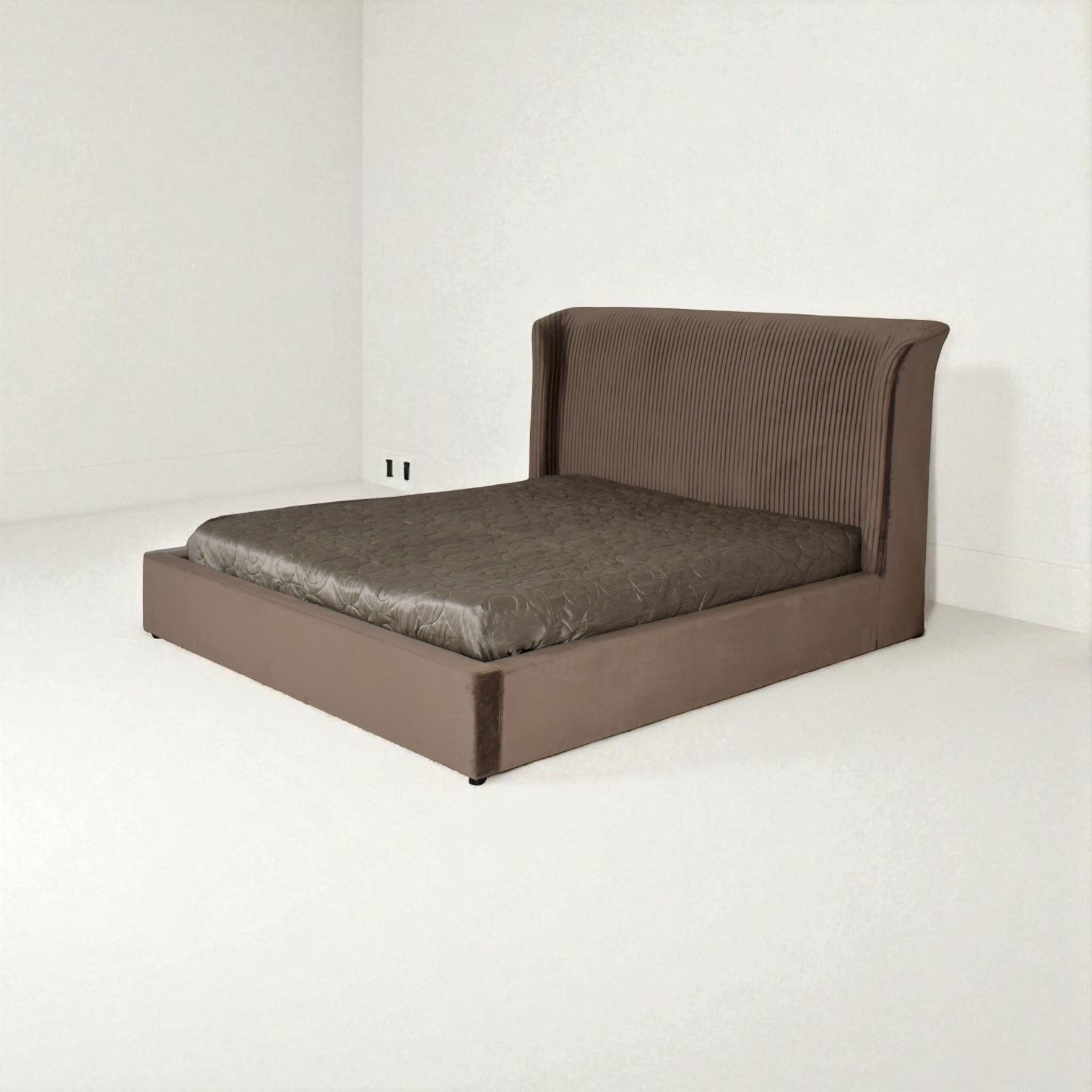 Brown bed with a textured finish on a white background