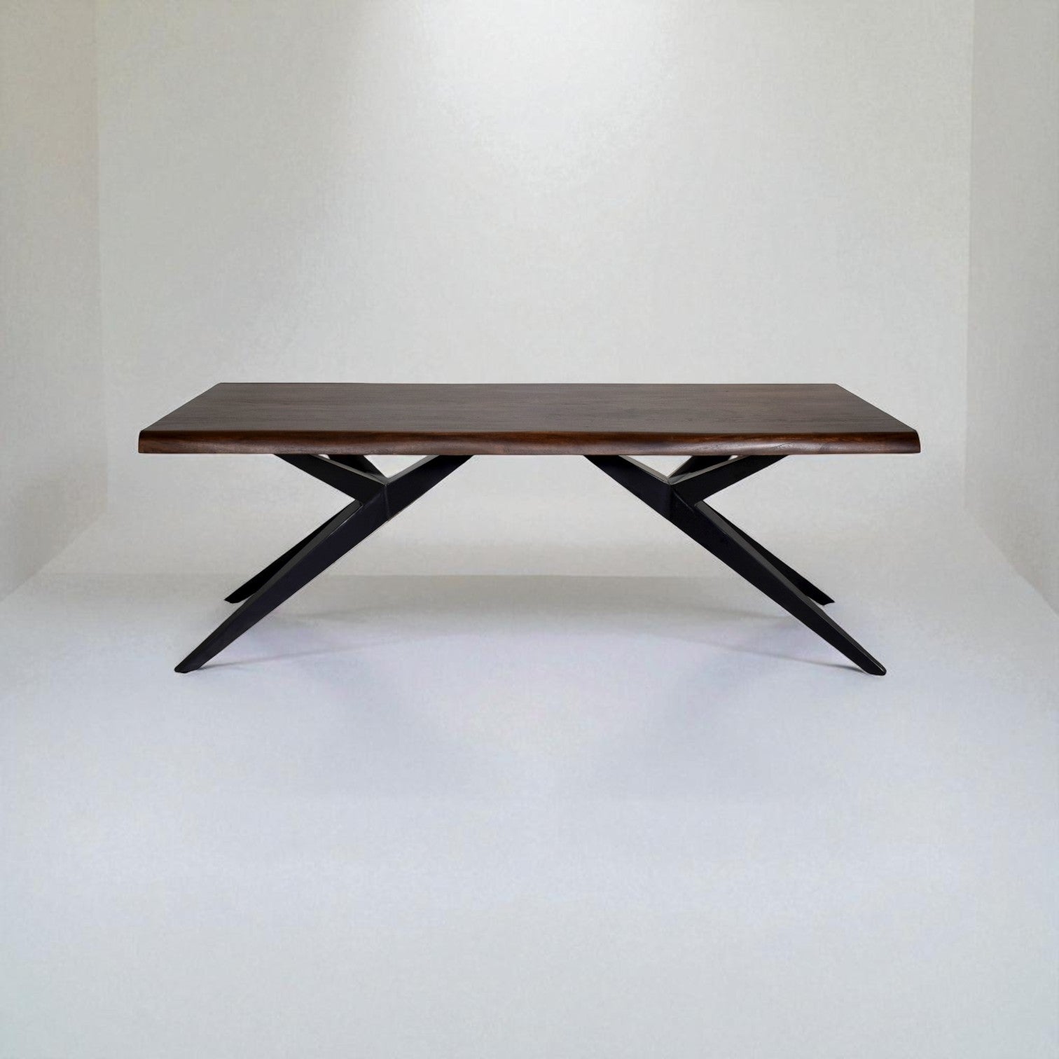 Wooden table with black metal legs on a white background
