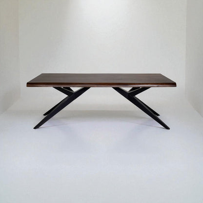 Wooden table with black metal legs on a white background