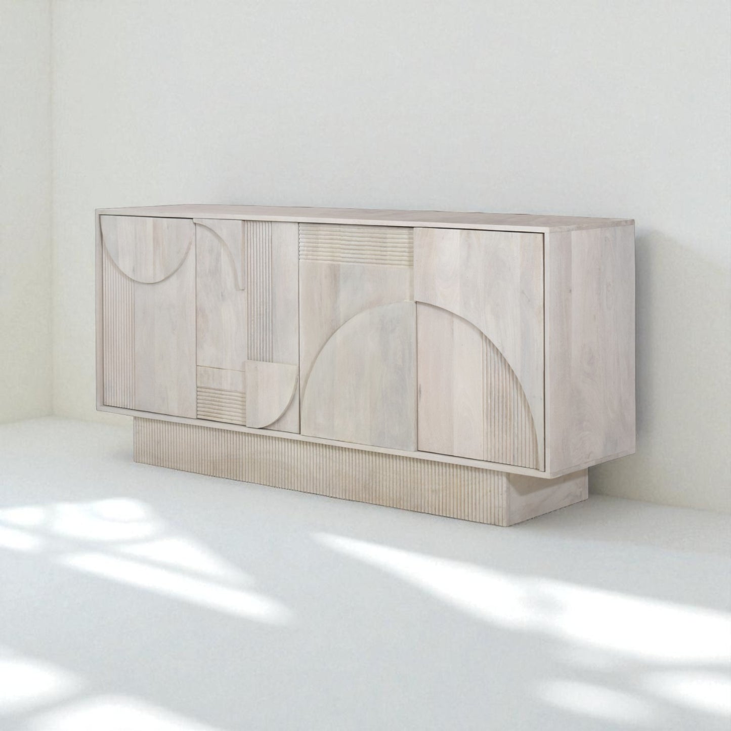 Beige sideboard with decorative items in a room setting