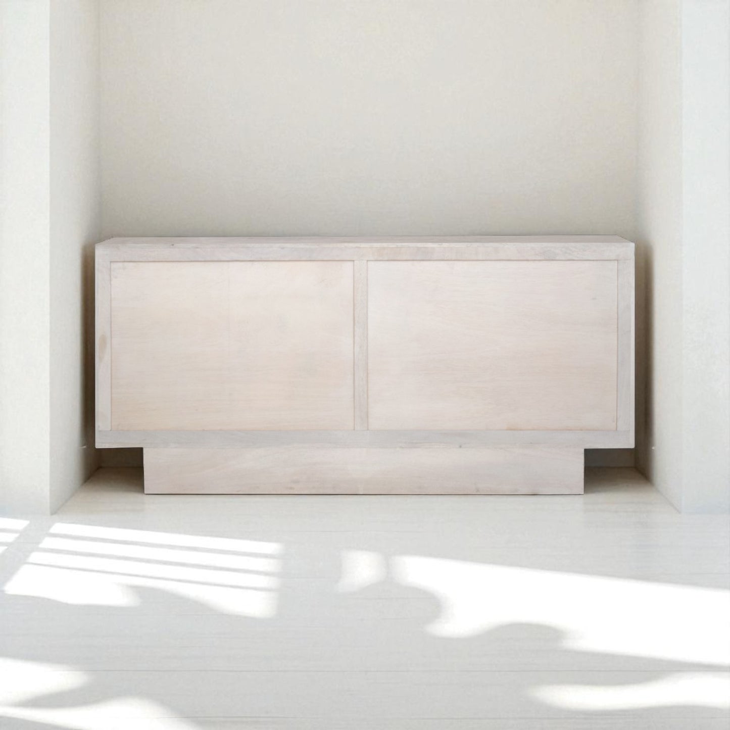 Beige sideboard with decorative items in a room setting