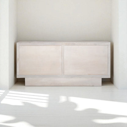 Beige sideboard with decorative items in a room setting