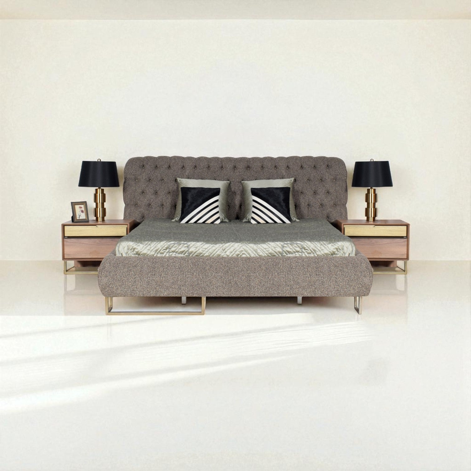 Gray upholstered bed with decorative pillows in a minimalistic bedroom setting.
