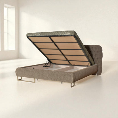 Gray upholstered bed frame with lifting mechanism on a white background