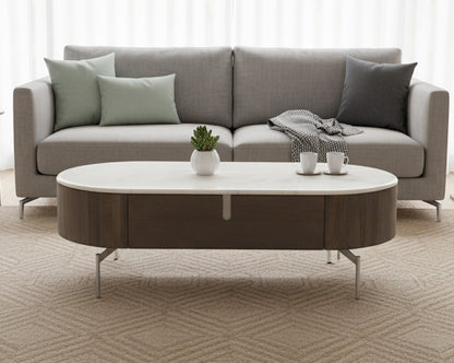 Gray sofa with a round coffee table in a living room setting