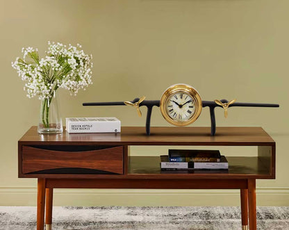 This unique vintage airplane propeller table clock comes with table and book the clock in the center of the wings. This antique clock is made out of brass in antique matt finish. It has a white dial with Roman Numerals for a vintage look. This is a great 