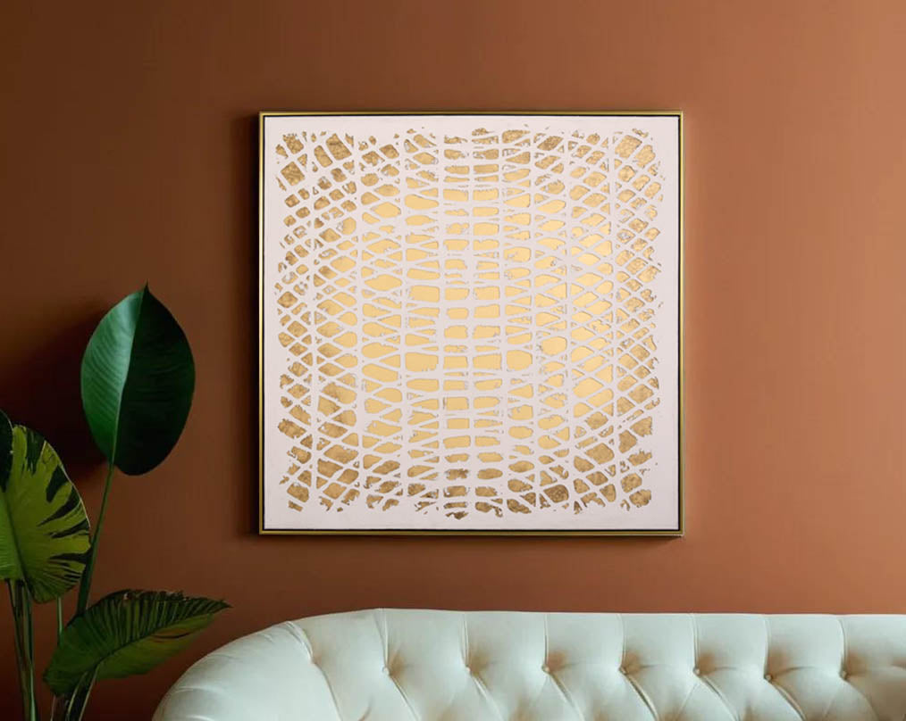 Abstract acrylic painting on canvas with gold frame perfect to enhance any modern and contemporary space. with sofa and plant 