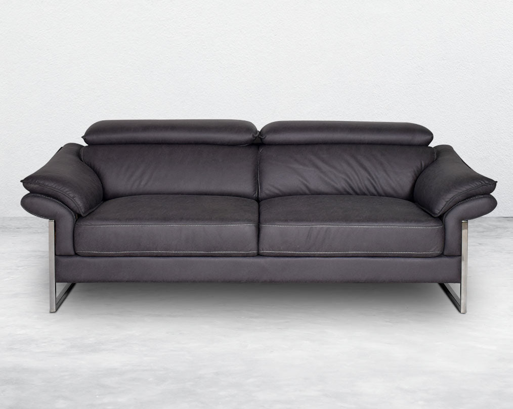 3  seater sofa set upholstered in fabric with adjustable headrest and stainless steel legs in sleek contemporary design.