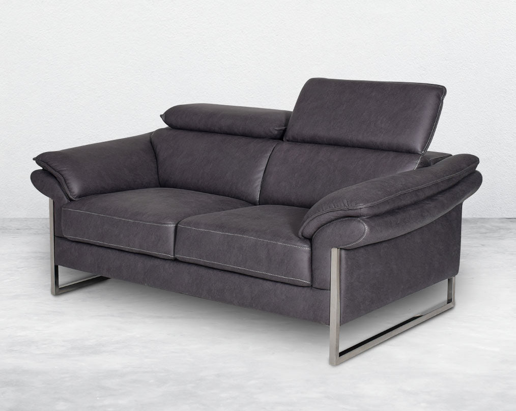 2 seater sofa set upholstered in fabric with adjustable headrest and stainless steel legs in sleek contemporary design.