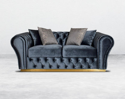 This 2 seater sofa set has a resplendent accentuated designer look and elegantly flared plush tufted armrests and backrest for an opulent style. The sofa is upholstered with high-quality velvet fabric and comes with 4 beautiful cushions to compliment