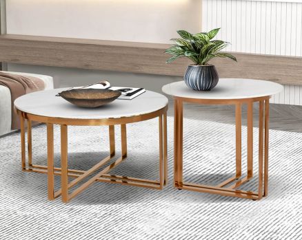 Round coffee & end table with book and plant  glossy sintered stone top and glossy rose gold plated stainless steel base in a geometric design