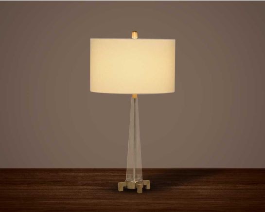 Table lamp with crystal and bronze metal decorative base with translucent fabric shade in ultra modern design