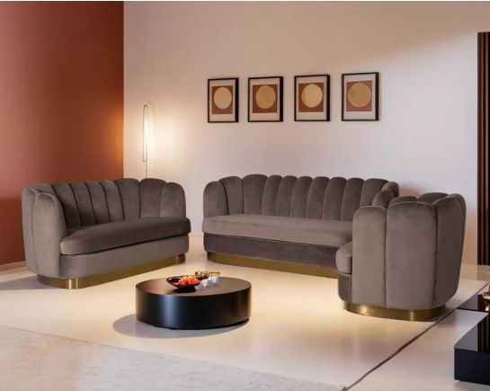 This 3+2+1 seater sofa set comes in high-quality velvet fabric with a vertical quilted backrest that accentuates the simplicity inspired by the graceful blossom of a flower. It has gold-plated stainless steel legs in a modern classic design.