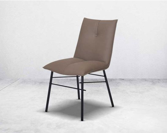 This dining chair is crafted in faux leather with matt black metal legs. It is sleek and modern in design.