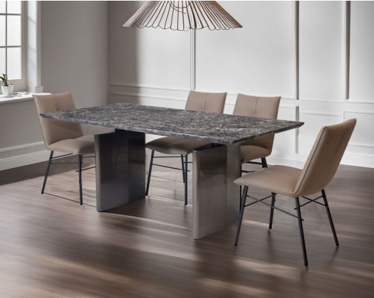 This 6 & 8 seater minimalistically designed dining table with grey marble top is an embodiment of contemporary chicness. This dining table in geometrical hexagonal base comes in glossy gunmetal finish in a contemporary design.

This sleek dining chair i
