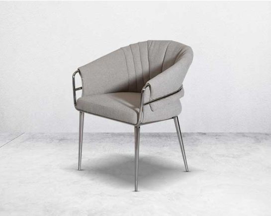 This predominantly eclectic and contemporary dining chair is upholstered in boucle fabric with glossy stainless steel frame & legs 