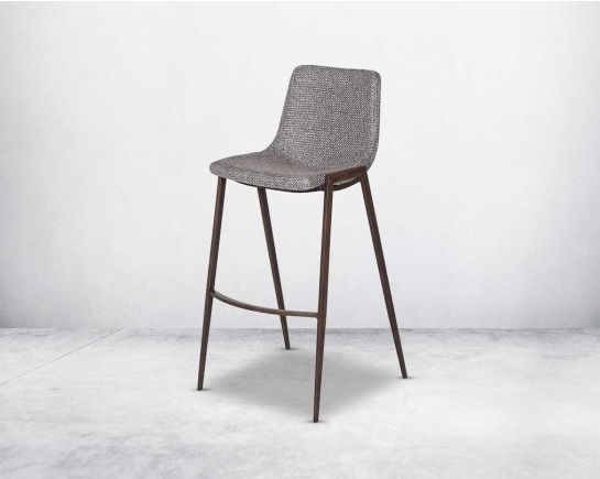 this wooden bar stool is a striking mix of industrial and modern. The supple seat, upholstered in fabric sits atop a stainless steel base in wood finish.