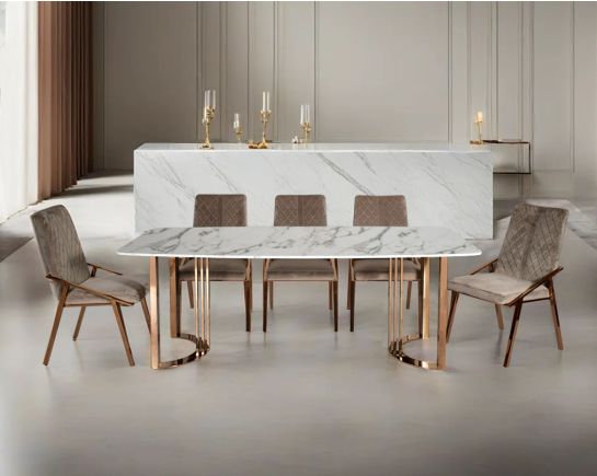 6 & 8 Seater rectangular dining table with white marble top and high polished rose gold plated stainless steel base. The dining chair is upholstered in faux leather withighlygh polished stainless steel legs plated in rose gold.