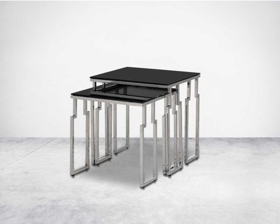Nested tables in a set of 2 with black tempered glass top and high polished stainless steel base in rich contemporary design.