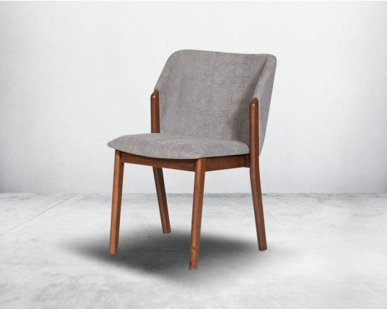 Dining chair upholstered in fabric with legs in walnut representing a sleek and modern style.