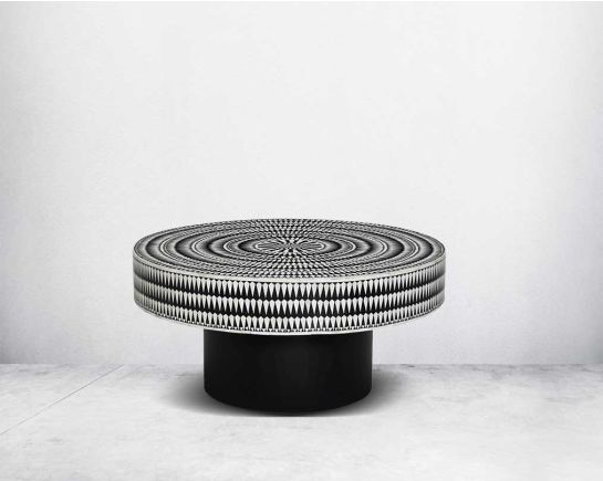 This gorgeous black and white inlay coffee table with a black metal base is a perfect statement piece in your living room.