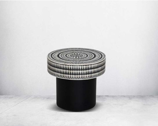 This gorgeous black and white inlay end table with a black metal base is a perfect statement piece in your living room.