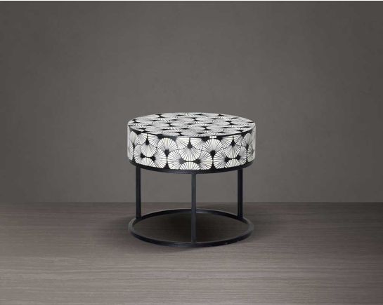 This gorgeous black and white inlay end table in floral pattern with a black metal base is a perfect statement piece in your living room.