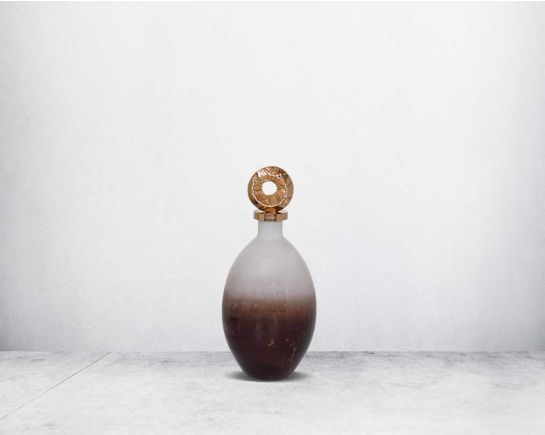 Decorative bottle in champagne & teak crust tinted lustre glass with ornamental antique gold plated aluminium lid.  small