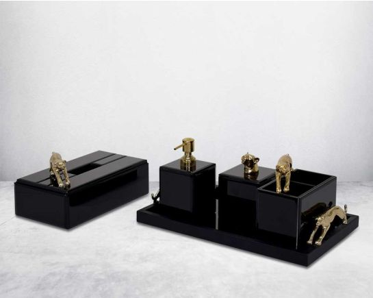 This modern & glam bathroom accessory designer set comprises a soap/lotion dispenser, a cotton jar, a tissue box & a tray in black glass with a gold leopard design motif making this set a perfect addition for a touch of allure to any bathroom.