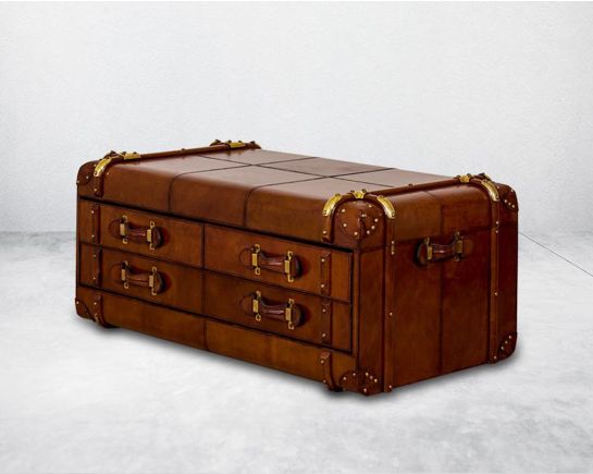 Coffee table in distressed cognac leather in a vintage look with 6 drawers with leather handles, in trunk design.