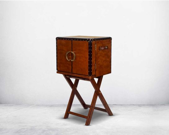 Bar cabinet in distressed cognac leather with a retro vintage look with brass hardware and wooden slats.