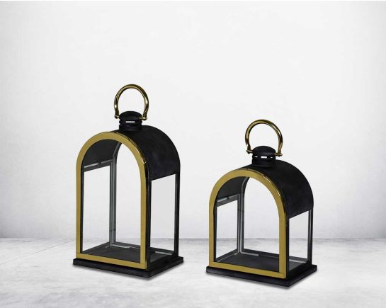 Lantern in clear glass and metal with gold plated stainless steel frame.