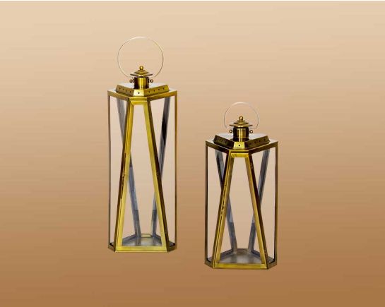 Lantern with clear glass and brass plated stainless steel.