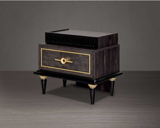 Bedside table in dark oak finish with antique gold design motif and two drawers with golden handles in modern classic design side view