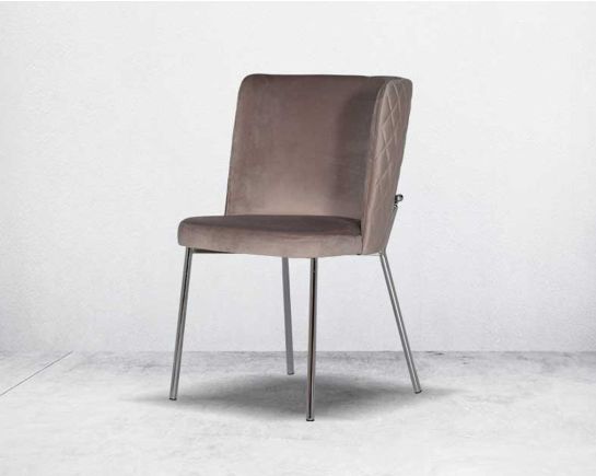 Minimalistically designed chair with criss-cross stitch padded fabric in silver finish stainless steel legs in contemporary design.